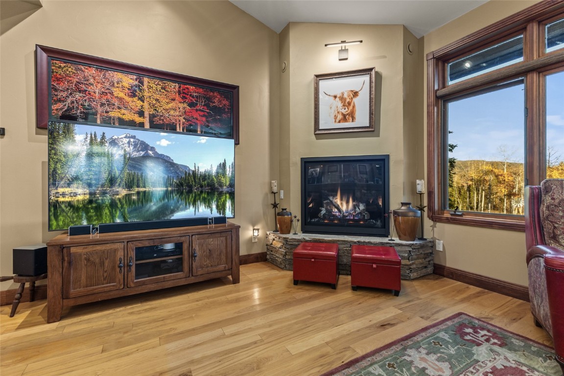32350 Los Ranchos Road Oak Creek, CO 80467 - Photo 12 of 50 a living room with furniture a large window and a fireplace