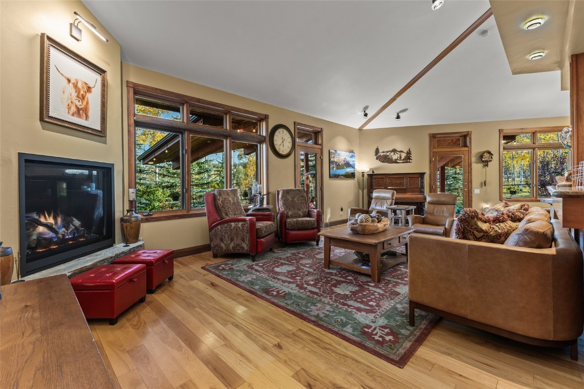 32350 Los Ranchos Road Oak Creek, CO 80467 - Photo 13 of 50 a living room with furniture large window and a fireplace