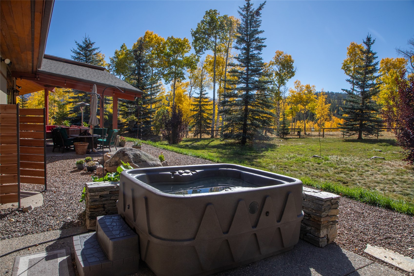 32350 Los Ranchos Road Oak Creek, CO 80467 - Photo 20 of 50 a outdoor sitting area with tall trees