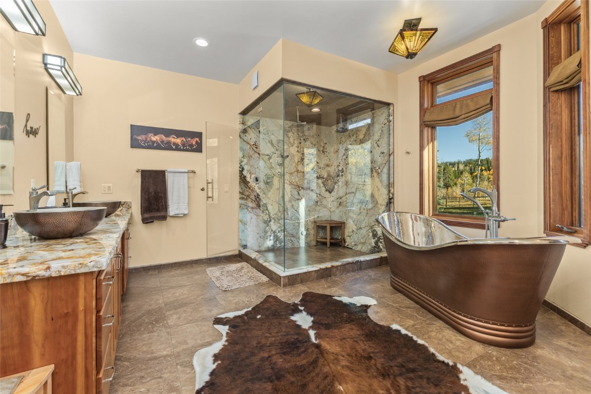 32350 Los Ranchos Road Oak Creek, CO 80467 - Photo 27 of 50 a living room with a couch and a table