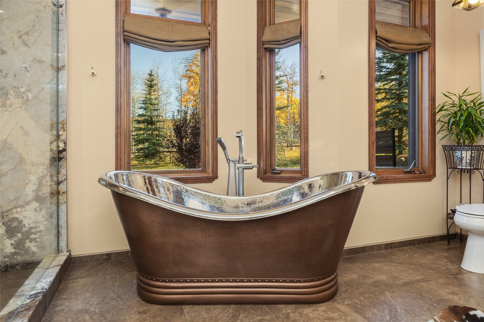32350 Los Ranchos Road Oak Creek, CO 80467 - Photo 29 of 50 a view of a living room with a bath tub and a window