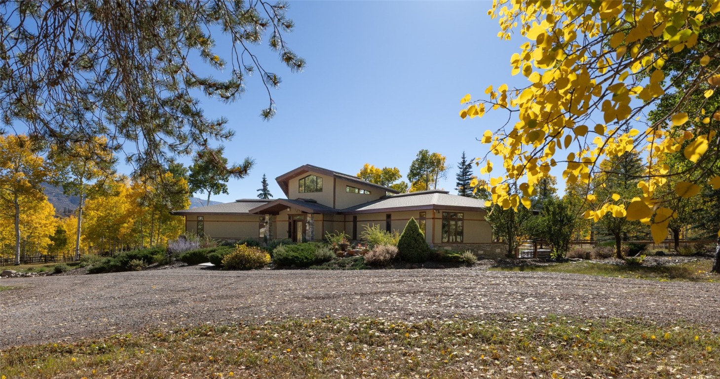 32350 Los Ranchos Road Oak Creek, CO 80467 - Photo 3 of 50 a front view of a house with a yard