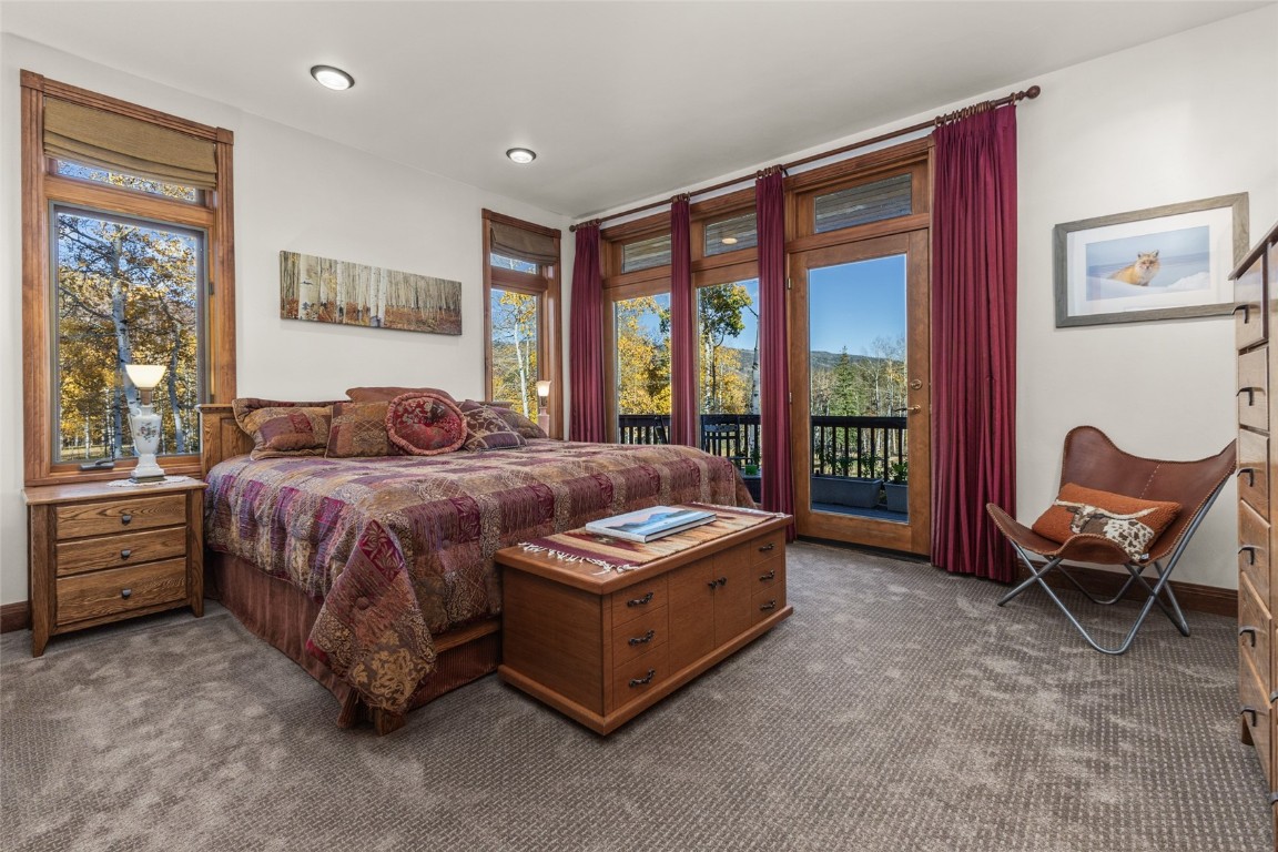 32350 Los Ranchos Road Oak Creek, CO 80467 - Photo 32 of 50 a bed room with a bed and a chair