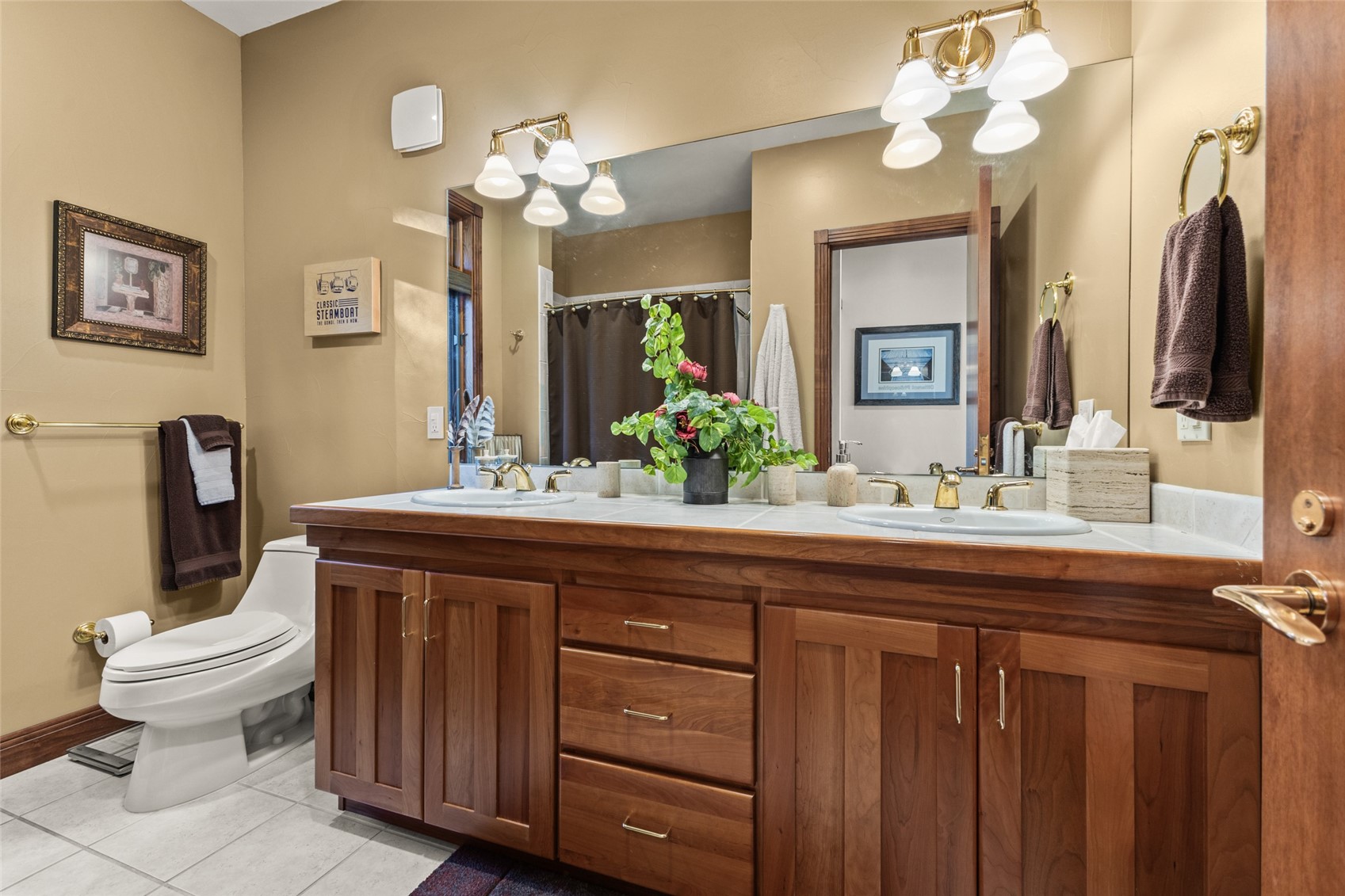 32350 Los Ranchos Road Oak Creek, CO 80467 - Photo 33 of 50 a bathroom with a granite countertop toilet sink and mirror