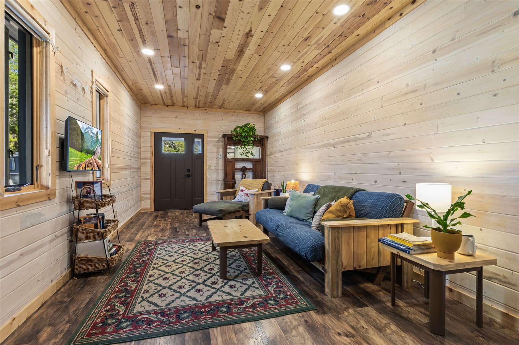 32350 Los Ranchos Road Oak Creek, CO 80467 - Photo 41 of 50 a living room with furniture and a chandelier