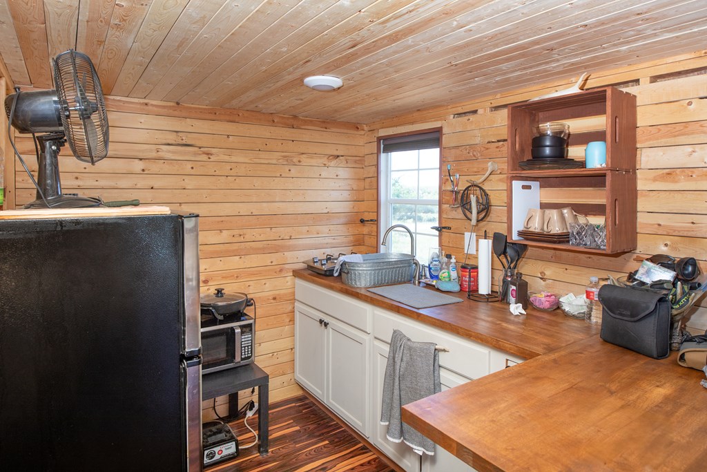 Eor N Spur Eden, TX 76837 - Photo 3 of 40 a kitchen with stainless steel appliances granite countertop a sink stove and cabinets