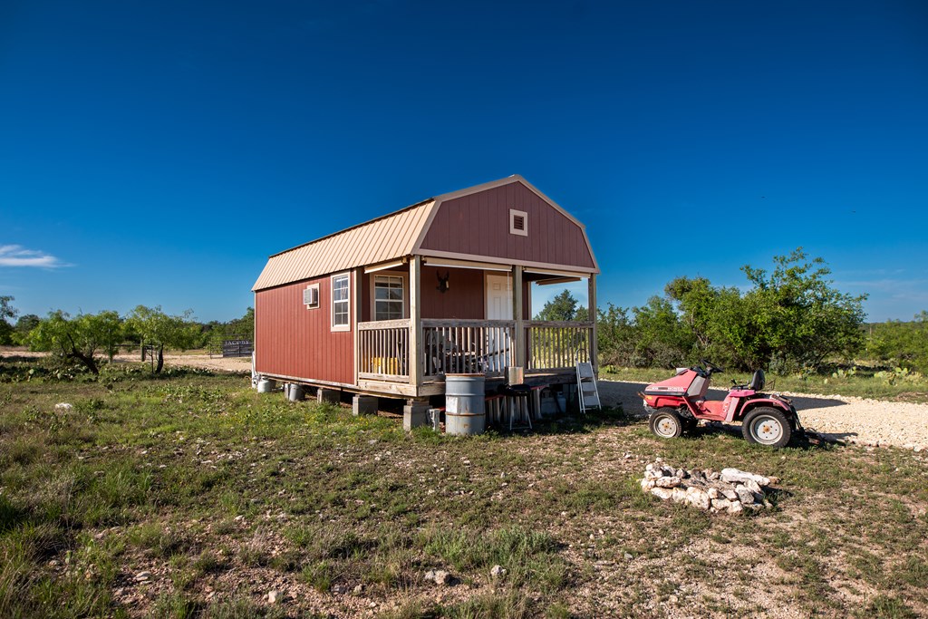 Eor N Spur Eden, TX 76837 - Photo 6 of 40 a front view of a house with a garden