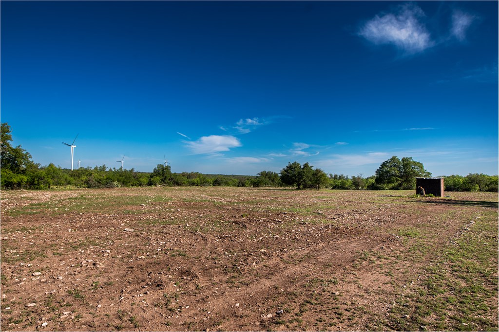 Eor N Spur Eden, TX 76837 - Photo 7 of 40 a view of an lake and a yard