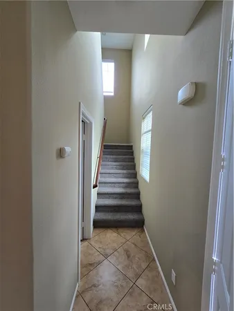 a spacious bathroom with a double vanity sink toilet mirror and bathtub