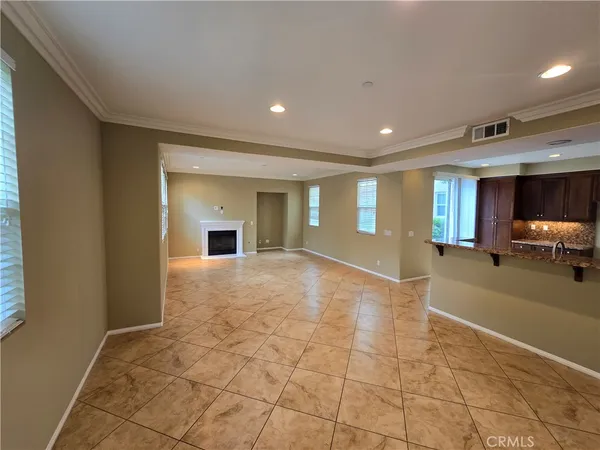 a view of a livingroom with furniture and a fireplace