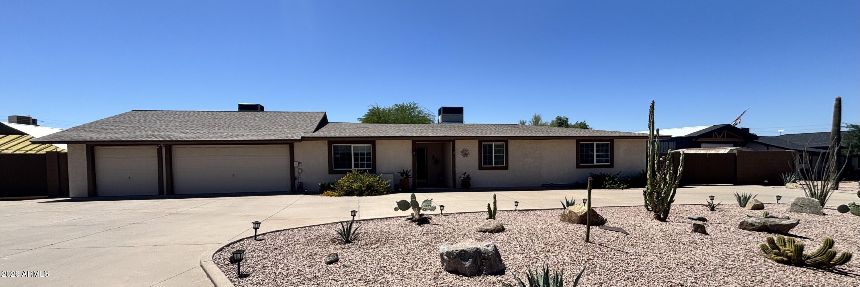 7745 East Mangun Road Mesa, AZ 85207 - Photo 2 of 35 a front view of a house with a yard