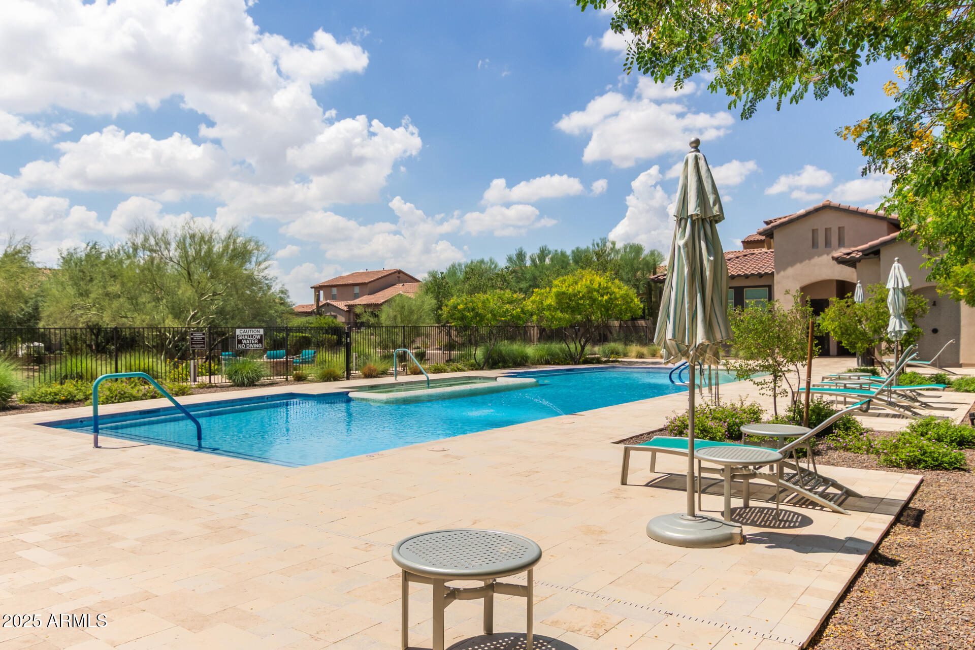 22943 North 73rd Way Scottsdale, AZ 85255 - Photo 48 of 49 a view of a swimming pool with lounge chairs