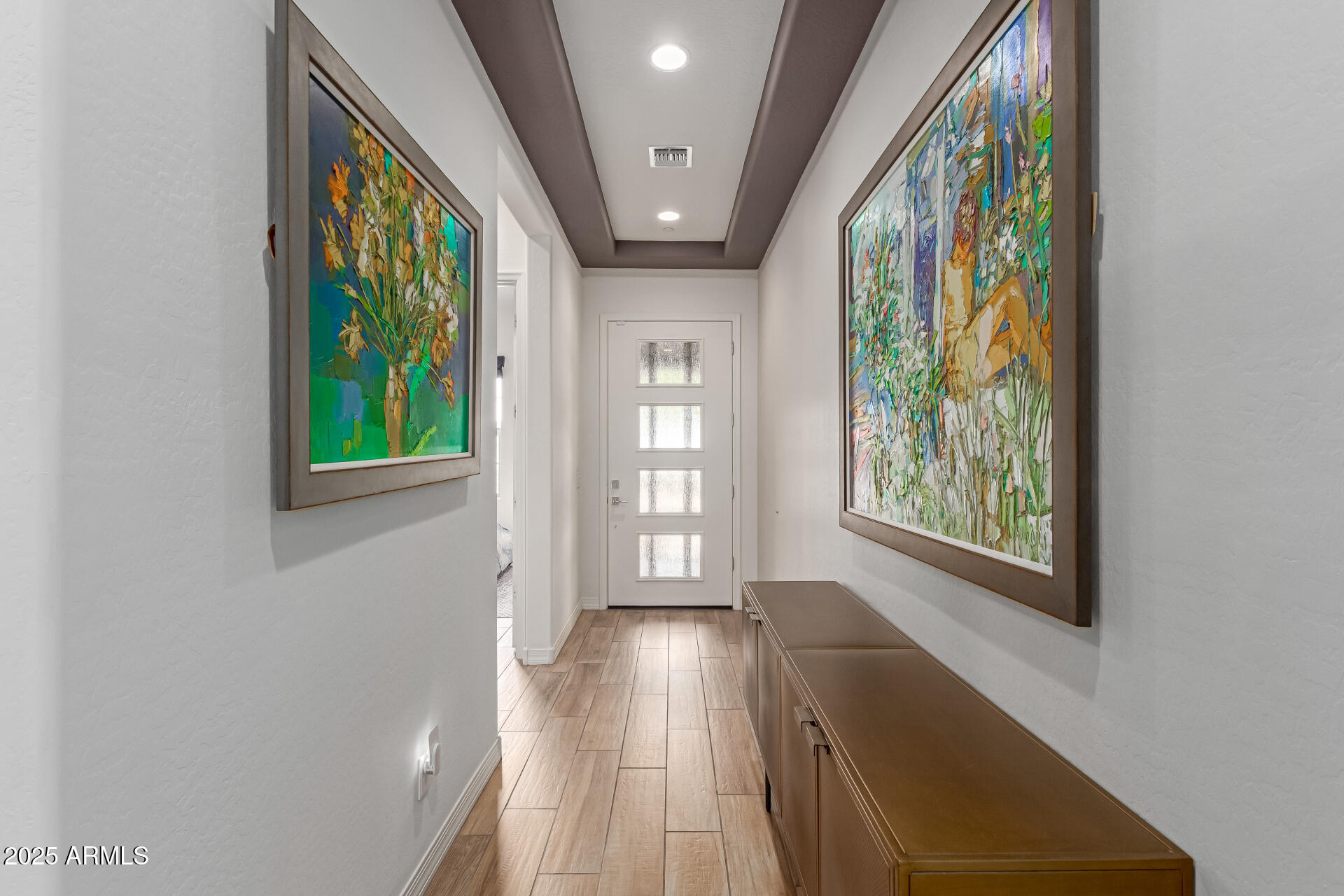 22943 North 73rd Way Scottsdale, AZ 85255 - Photo 6 of 49 a view of hallway with a front door and wooden floor