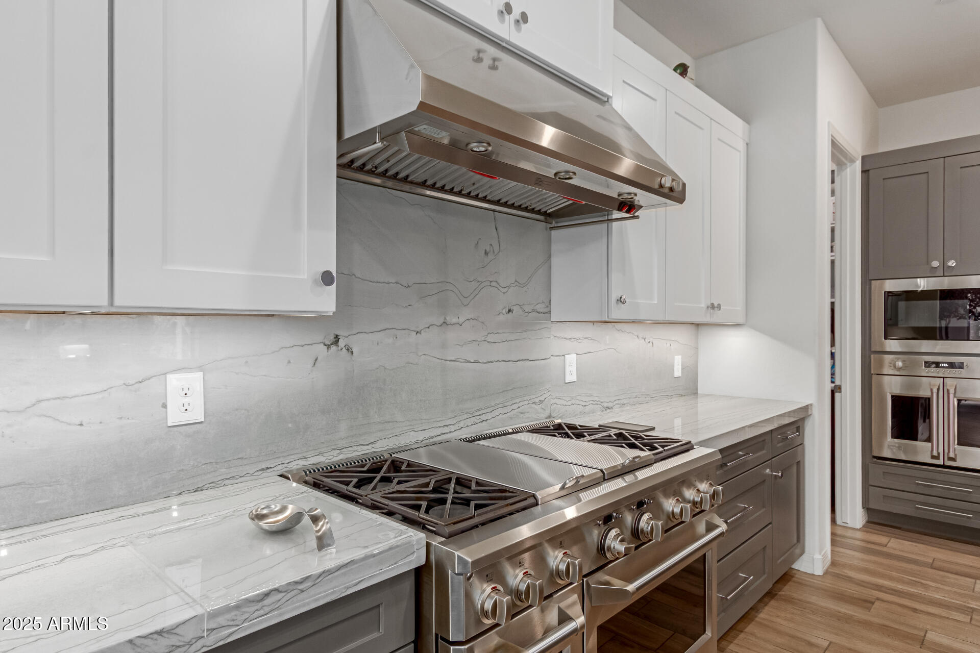22943 North 73rd Way Scottsdale, AZ 85255 - Photo 10 of 49 a stove top oven sitting inside of a kitchen