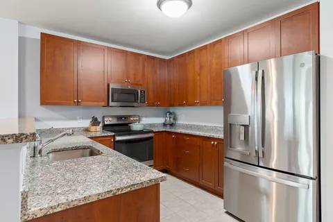 a kitchen with a refrigerator sink and microwave