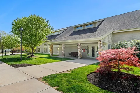 a front view of a house with a yard and porch