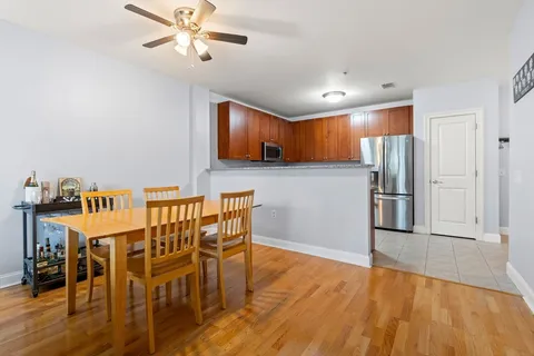 a view of a dining room with furniture and wooden floor