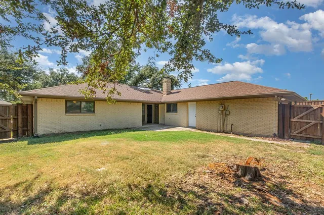 a house that has a tree in front of it