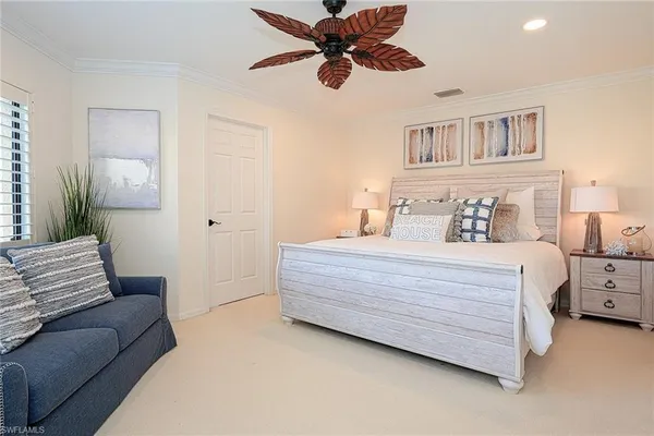 a bedroom with a bed and a couch