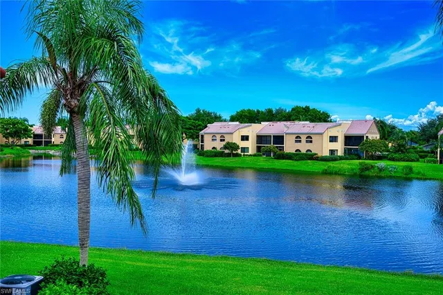 a view of a lake with houses in the background