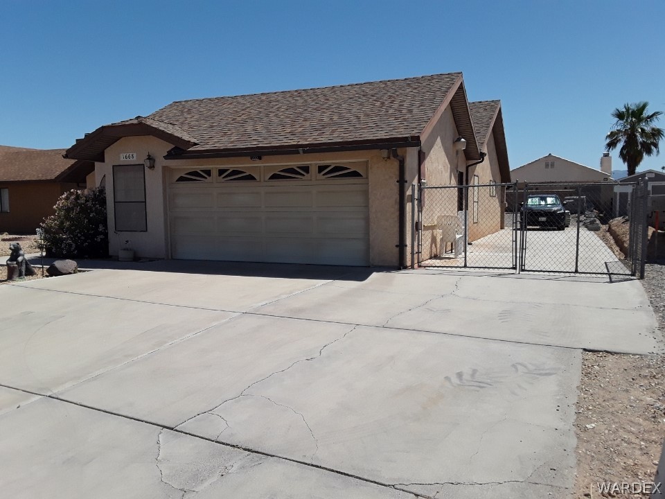 1668 Brill Way Bullhead City, AZ 86442 - Photo 3 of 49 Driveway & RV/Boat parking pad