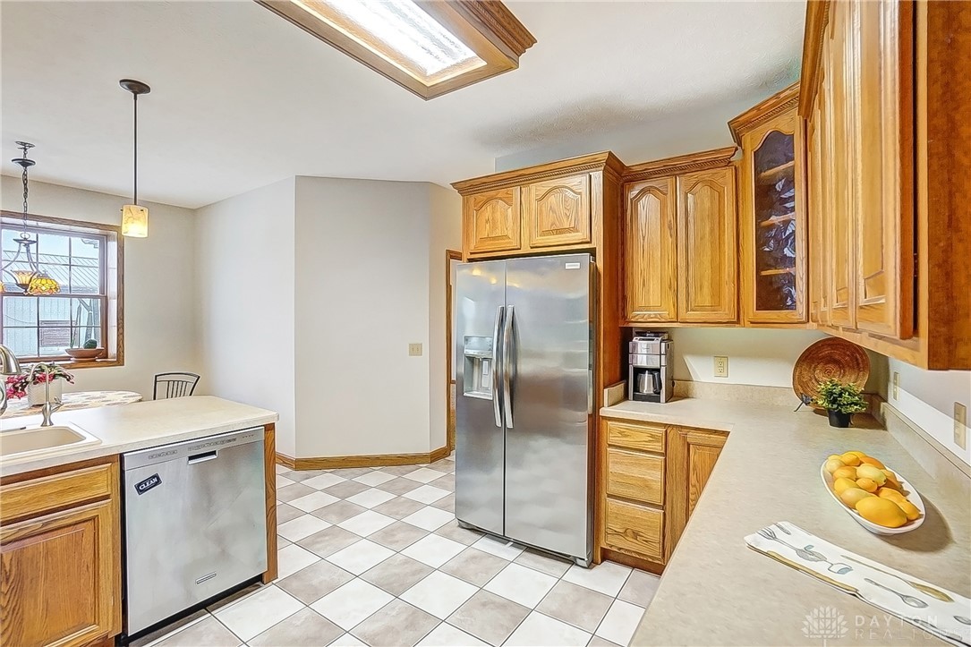 1540 Jasper Road Xenia, OH 45385 - Photo 19 of 91 This spacious kitchen offers ample cabinetry, modern appliances, and a classic tiled floor.