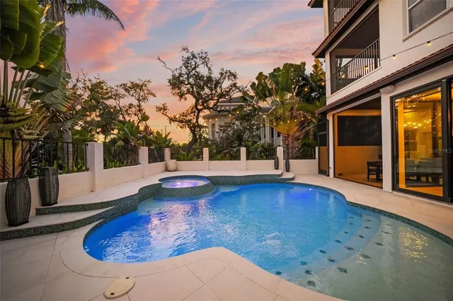 a view of a swimming pool with an outdoor seating