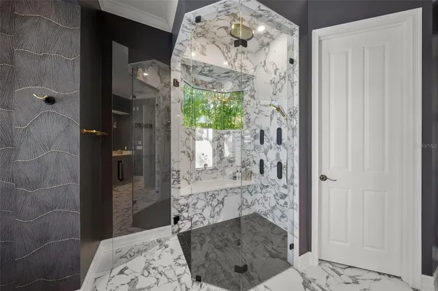 a living room with a large bed furniture and a flat screen tv