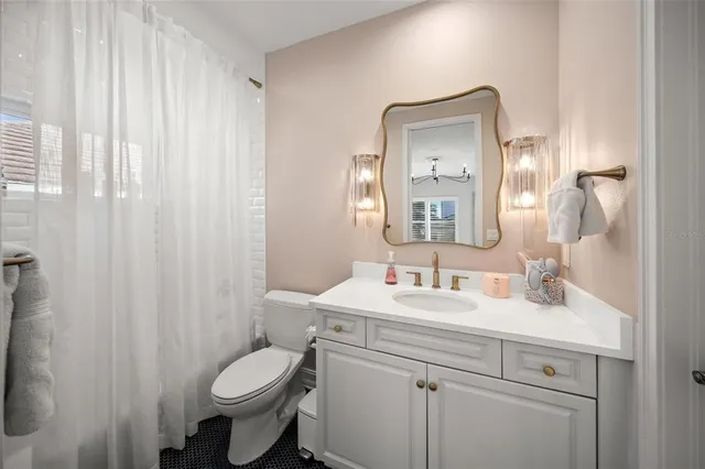 a view of a kitchen with a sink and washing machine