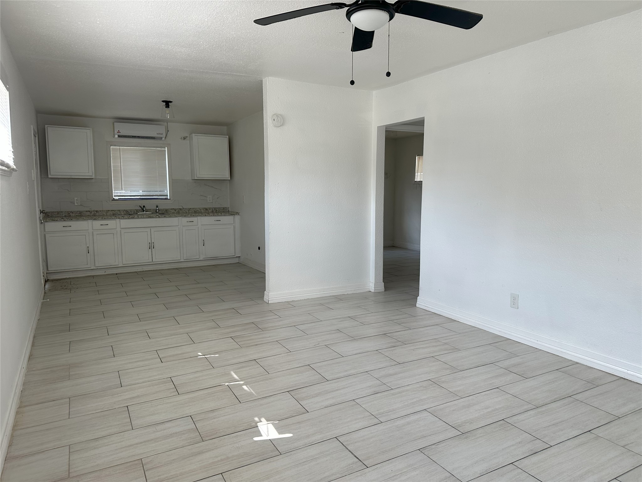 3829 Mt Pleasant Street Houston, TX 77021 - Photo 2 of 7 a view of a kitchen with a sink and a refrigerator