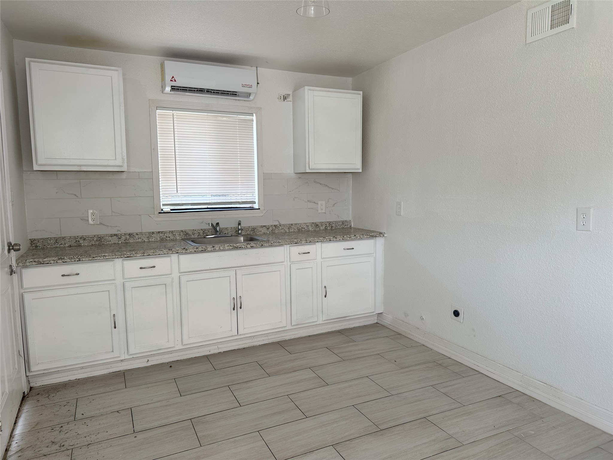 3829 Mt Pleasant Street Houston, TX 77021 - Photo 3 of 7 a kitchen with a sink cabinets and utility