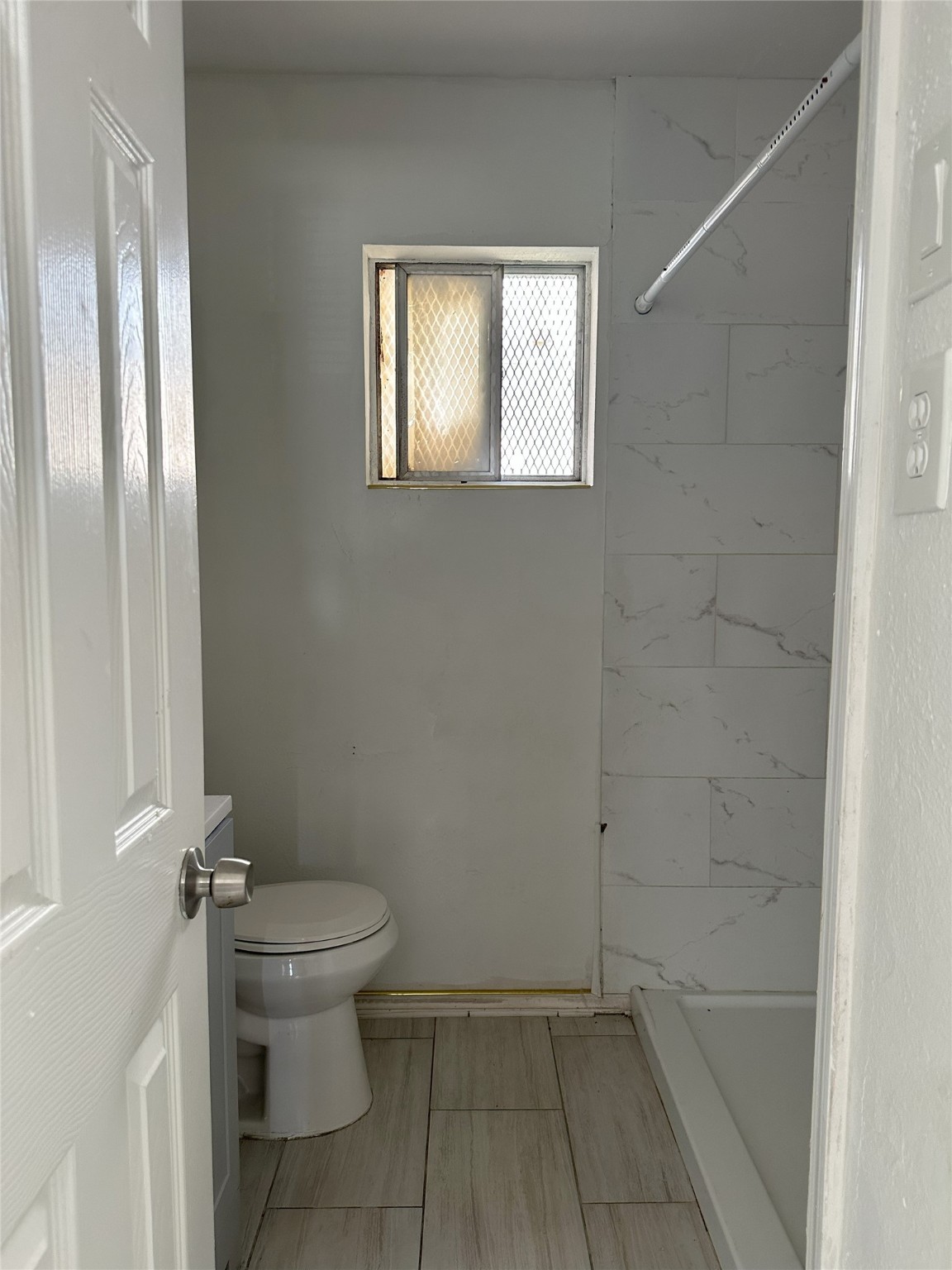 3829 Mt Pleasant Street Houston, TX 77021 - Photo 7 of 7 a bathroom with a granite countertop toilet and a shower