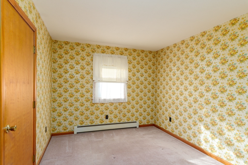 85 Marsh Road Barre, MA 01005 - Photo 12 of 27 a view of an empty room and a window