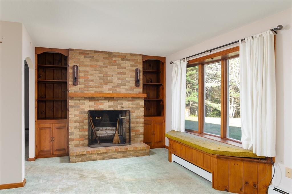 85 Marsh Road Barre, MA 01005 - Photo 14 of 27 a living room with furniture and a fireplace