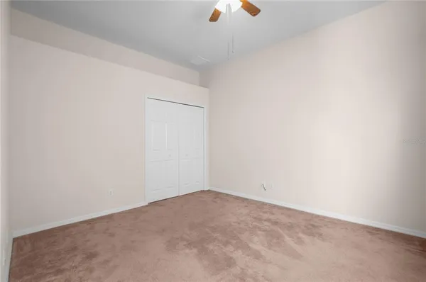 a view of an empty room with windows