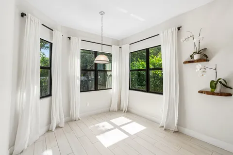 a view of entryway with wooden floor