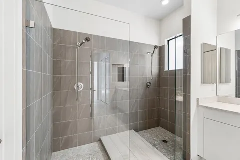 a bathroom with a shower and a sink