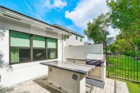 a view of house with swimming pool outdoor seating