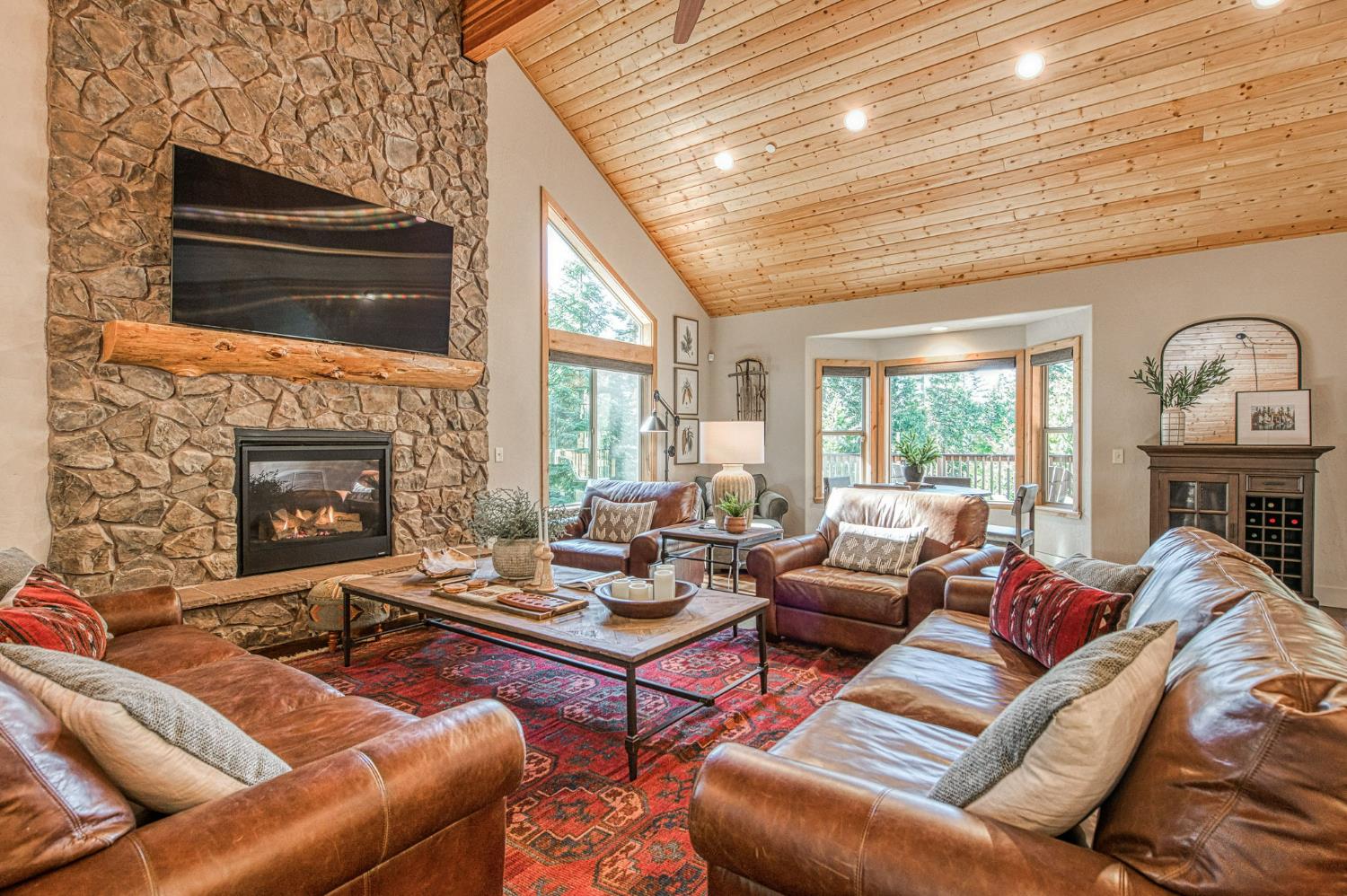 41876 Timber View Lane Shaver Lake, CA 93664 - Photo 28 of 85 a living room with furniture fireplace and a flat screen tv