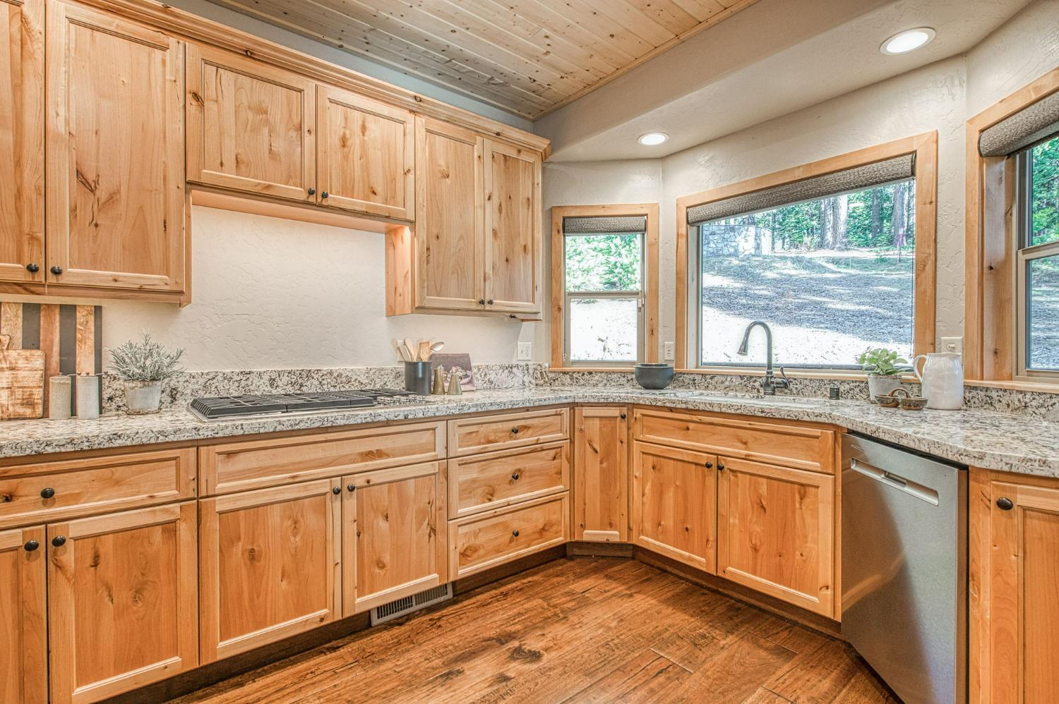 41876 Timber View Lane Shaver Lake, CA 93664 - Photo 38 of 85 a kitchen with granite countertop cabinets stainless steel appliances a sink and large window