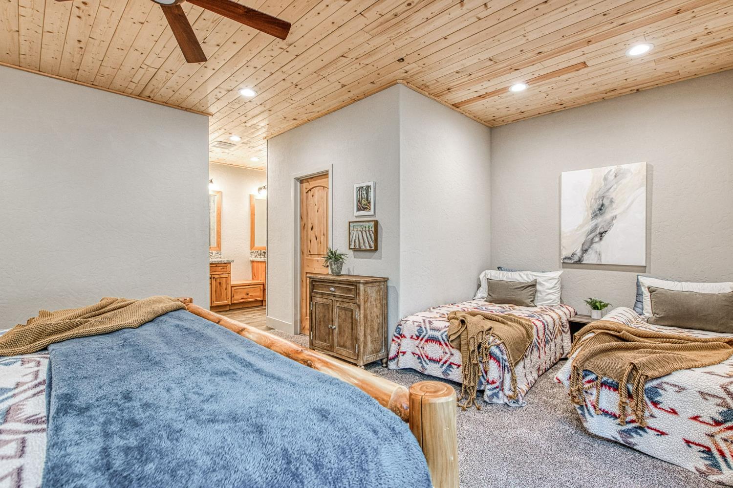 41876 Timber View Lane Shaver Lake, CA 93664 - Photo 48 of 85 a bedroom with two beds and painting on the wall