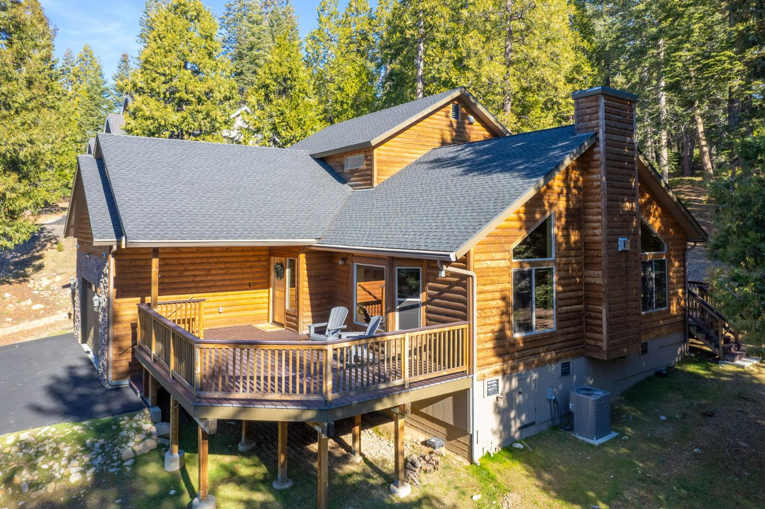 41876 Timber View Lane Shaver Lake, CA 93664 - Photo 9 of 85 a view of a house with a wooden deck and a backyard