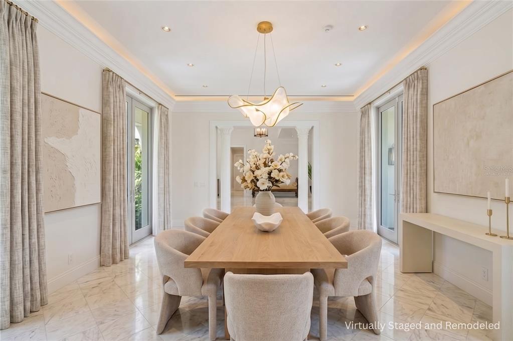 3315 Bay Shore Road Sarasota, FL 34234 - Photo 5 of 96 a view of a dining room with furniture and a chandelier