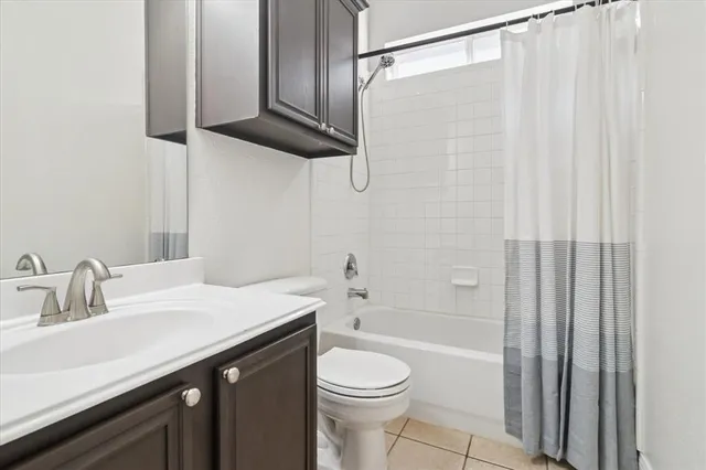 a utility room with stainless steel appliances washer and dryer