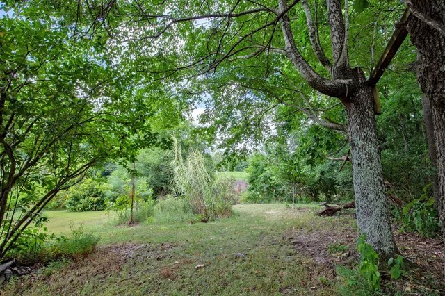 a view of a deck with a wooden floor and fence
