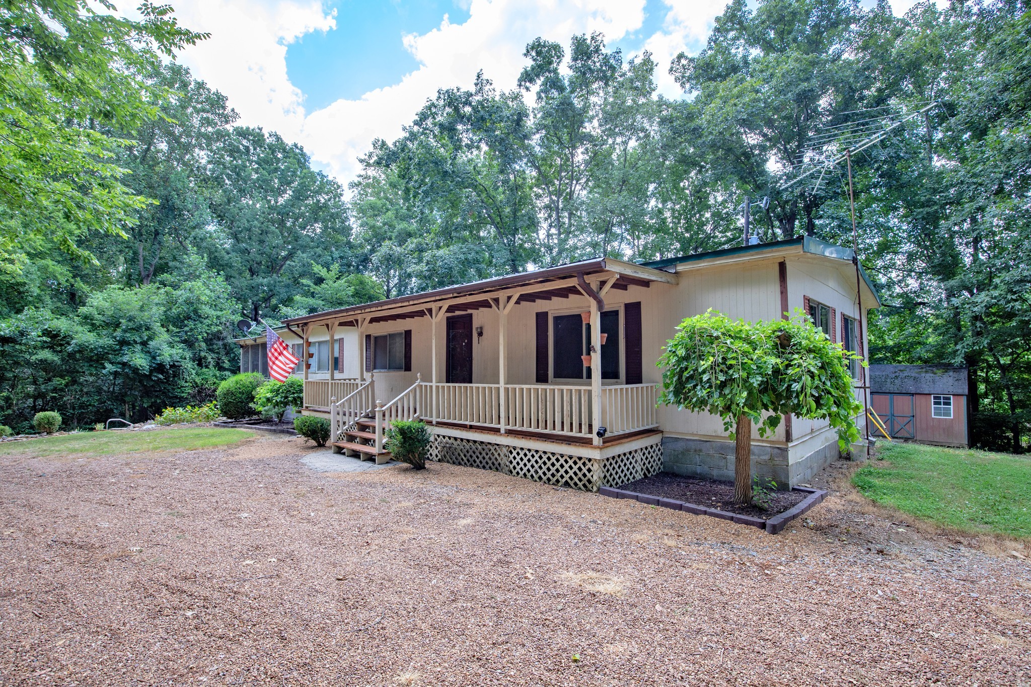 7498 Swift Road Greenbrier, TN 37073 - Photo 14 of 69 a house that has a tree in front of it