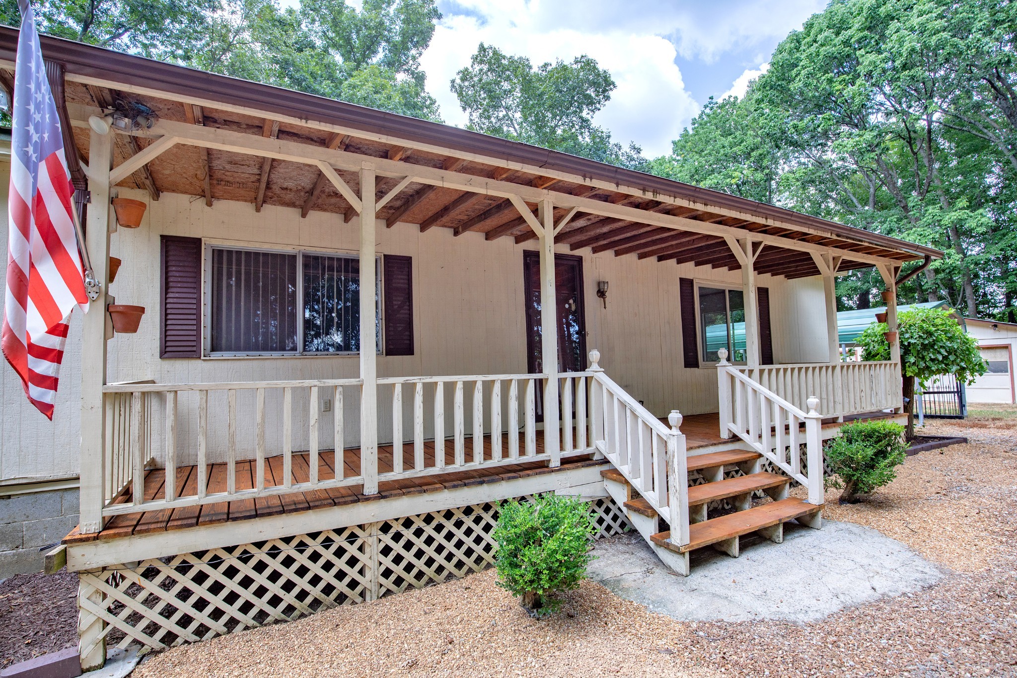 7498 Swift Road Greenbrier, TN 37073 - Photo 15 of 69 a view of a deck with a wooden floor and fence