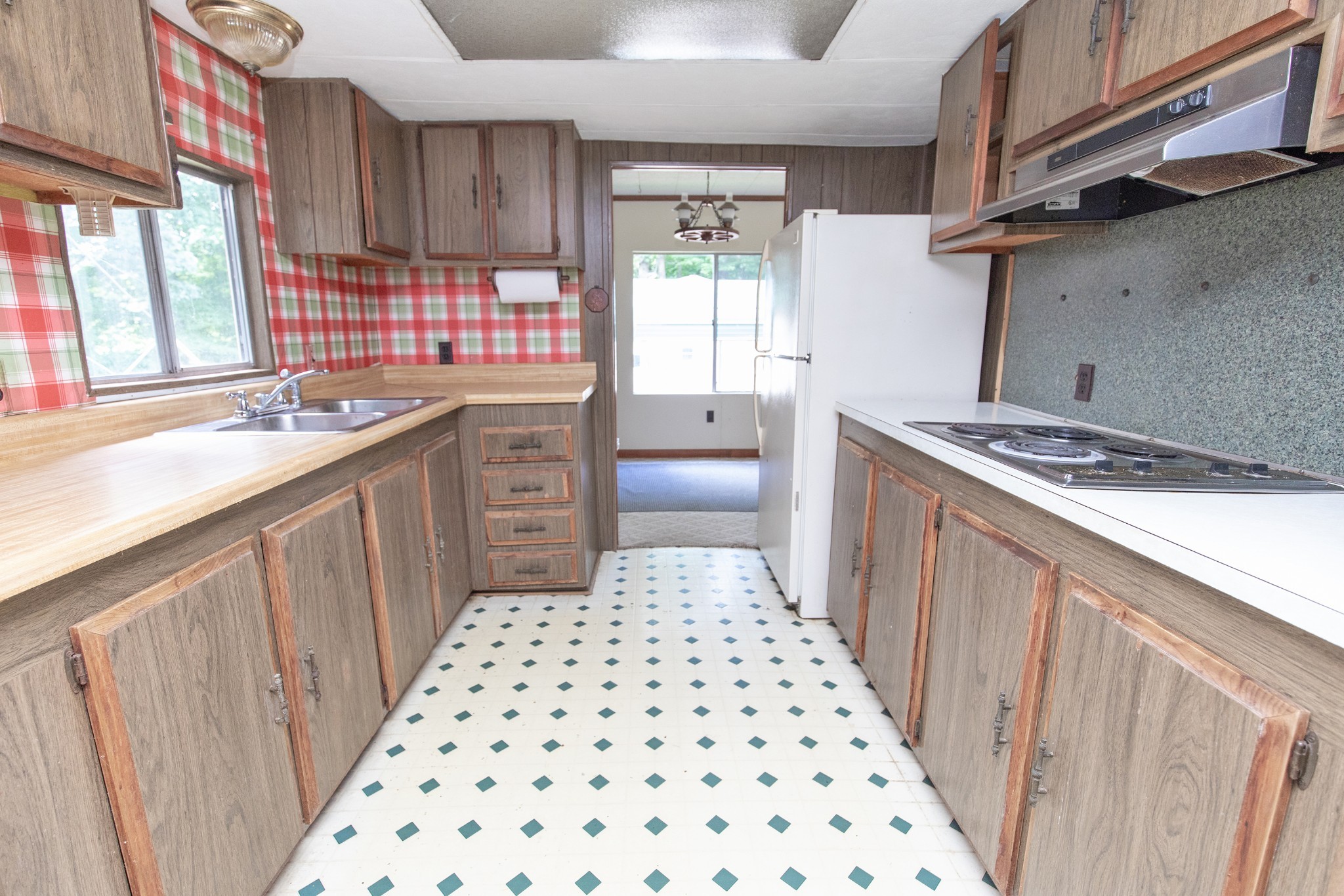 7498 Swift Road Greenbrier, TN 37073 - Photo 22 of 69 a kitchen with a sink a stove a refrigerator and a window
