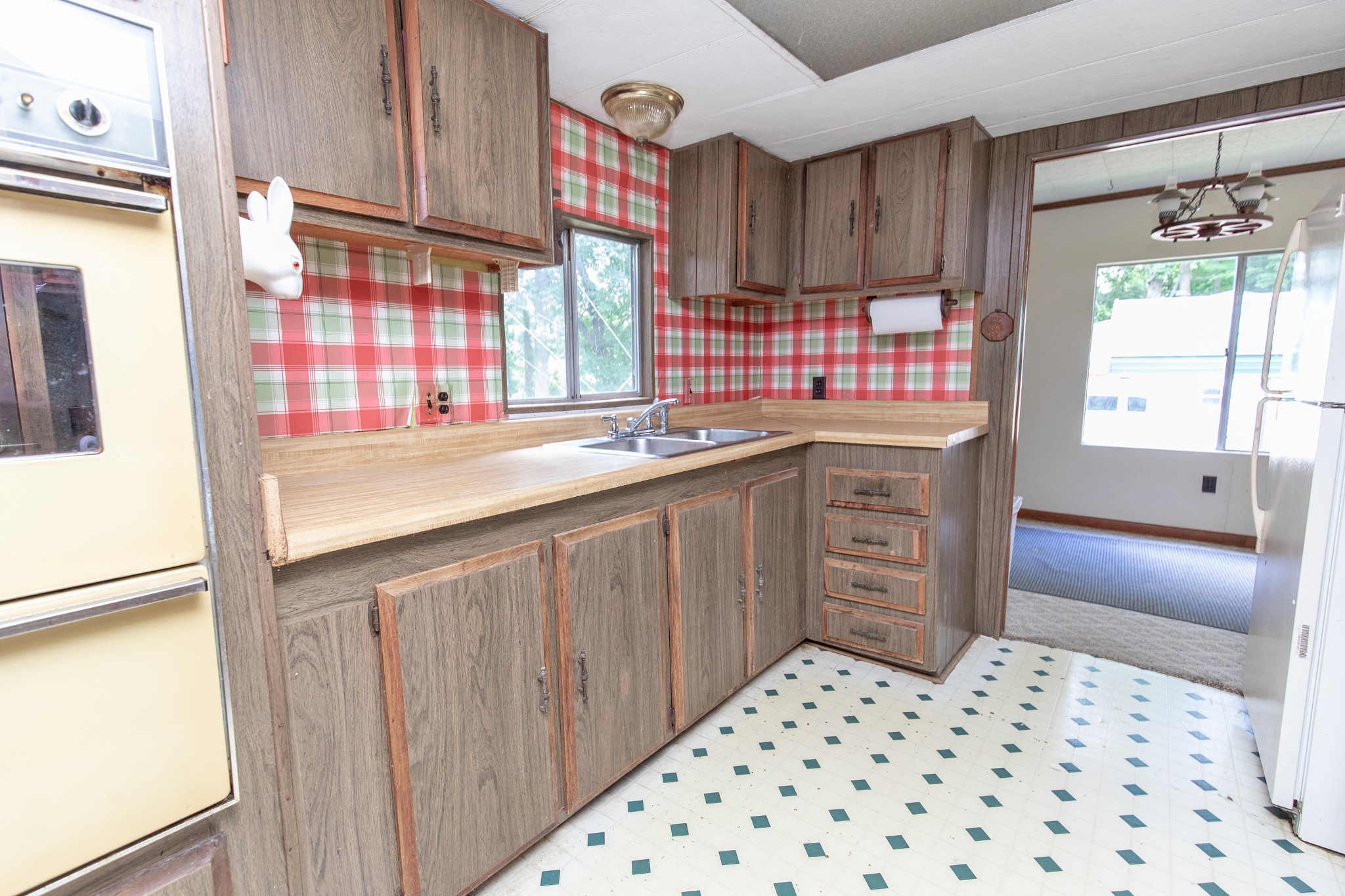 7498 Swift Road Greenbrier, TN 37073 - Photo 24 of 69 a kitchen with a sink a stove a window and cabinets