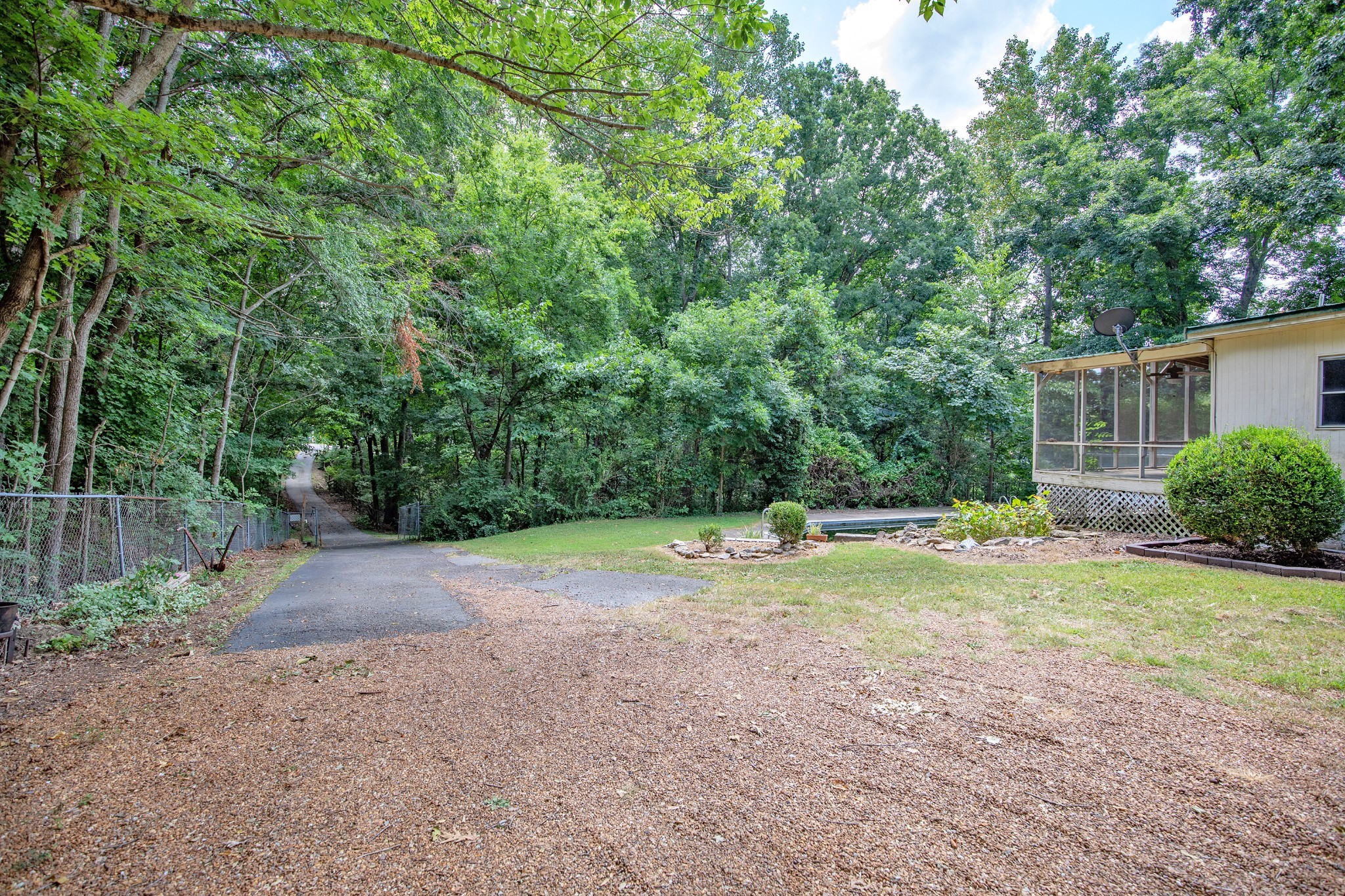 7498 Swift Road Greenbrier, TN 37073 - Photo 45 of 69 a backyard of a house with a yard and trampoline
